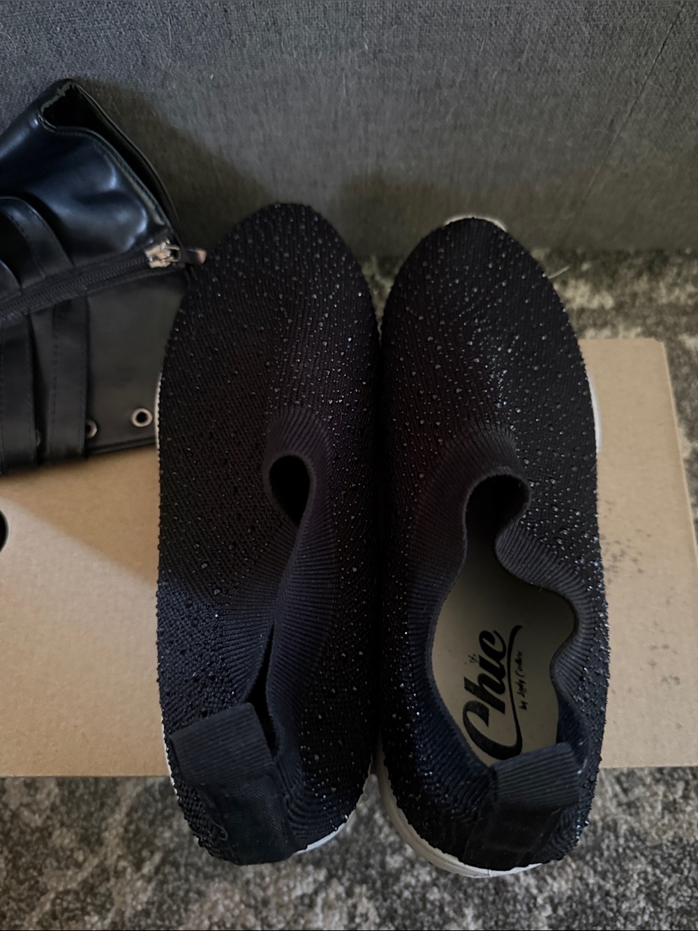 Chic Black Knit Slip-On Sneakers with Subtle Rhinestone Detail